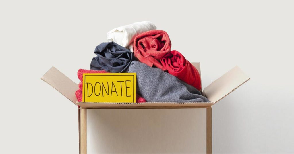 Donation box filled with children's clothes